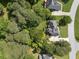 Desirable neighborhood featuring lush green canopy, well-maintained lawns and landscaping surrounding each lovely home at 1605 Little Lisa Ln, Snellville, GA 30078