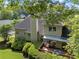 Overhead backyard view of a deck, dining area, mature trees and landscaping offers privacy and outdoor living at 1605 Little Lisa Ln, Snellville, GA 30078