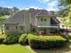 Overhead view of a home’s deck, outdoor seating, and lush greenery creates a private outdoor space at 1605 Little Lisa Ln, Snellville, GA 30078