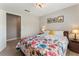 Comfortable bedroom featuring a decorative floral comforter, side tables and neutral paint at 1605 Little Lisa Ln, Snellville, GA 30078