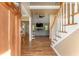 Welcoming foyer with hardwood floors, staircase, and views of the living room; open concept design at 1605 Little Lisa Ln, Snellville, GA 30078