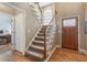 Welcoming foyer featuring a hardwood floor and staircase at 1605 Little Lisa Ln, Snellville, GA 30078