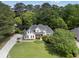 Charming two-story home boasts a lush green lawn and meticulously manicured landscaping at 1605 Little Lisa Ln, Snellville, GA 30078