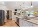 Kitchen view highlighting granite counters, stainless steel appliances and fixtures, and beautiful natural lighting at 1605 Little Lisa Ln, Snellville, GA 30078