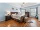 The main bedroom boasts hardwood floors, tray ceiling, and ensuite bath at 1605 Little Lisa Ln, Snellville, GA 30078
