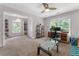 Bright office space with large window, desk, shelves and neutral carpet at 1605 Little Lisa Ln, Snellville, GA 30078