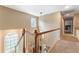 Upstairs hallway with access to the bedrooms and the upstairs bathroom at 1605 Little Lisa Ln, Snellville, GA 30078
