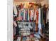 Well-organized walk-in closet maximizes storage space at 1605 Little Lisa Ln, Snellville, GA 30078