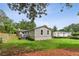 Exterior side view of home featuring well maintained lawn, landscaping, and privacy fence at 185 Pamela Nw St, Marietta, GA 30064