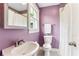 Bathroom featuring a vanity, mirror, toilet, and shower with white shower curtain at 185 Pamela Nw St, Marietta, GA 30064
