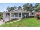 Charming brick home with a welcoming front porch, beautiful landscaping, and an attached single car garage at 185 Pamela Nw St, Marietta, GA 30064