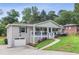 Charming brick home with inviting front porch, well-manicured lawn and attached garage at 185 Pamela Nw St, Marietta, GA 30064