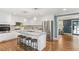 Spacious kitchen featuring white cabinets, stainless steel appliances, granite countertops and seating at the island at 185 Pamela Nw St, Marietta, GA 30064