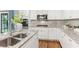 Bright kitchen with stainless appliances, granite countertops, and center island sink at 185 Pamela Nw St, Marietta, GA 30064