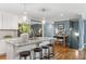 Spacious kitchen island with stainless sink, granite countertop, and bar stool seating at 185 Pamela Nw St, Marietta, GA 30064
