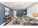 Stylish living room featuring hardwood floors, elegant decor, and a comfortable sofa with throw pillows at 185 Pamela Nw St, Marietta, GA 30064