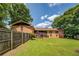 Expansive backyard and screened porch highlight the back exterior of the home at 1850 Francis Sw Rd, Conyers, GA 30094