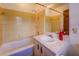 This bathroom features a shower over tub and vanity cabinet with sink, plus yellow tile at 1850 Francis Sw Rd, Conyers, GA 30094