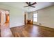 A bright bedroom features wood floors, a window, and a ceiling fan for added comfort at 1850 Francis Sw Rd, Conyers, GA 30094