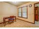 Bright dining room with tiled floors featuring a window with blinds at 1850 Francis Sw Rd, Conyers, GA 30094