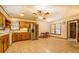Eat-in kitchen with wood cabinets, stainless steel appliances, and tile flooring at 1850 Francis Sw Rd, Conyers, GA 30094