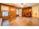 Cozy living room with wood-paneled walls, hardwood floors, and comfortable seating at 1850 Francis Sw Rd, Conyers, GA 30094