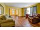 Spacious living room with hardwood floors, natural light, and ample seating at 1850 Francis Sw Rd, Conyers, GA 30094