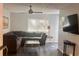 Inviting living room with a comfortable sectional sofa, sleek coffee table, and modern ceiling fan at 3796 Kensingwood Trce, Decatur, GA 30032