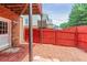 Enclosed backyard area with a red fence for added privacy at 3990 Howell Park Rd, Duluth, GA 30096
