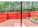 Fenced backyard with red mulch and a privacy fence at 3990 Howell Park Rd, Duluth, GA 30096