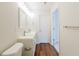 Bathroom featuring double vanity and wood-look floor at 3990 Howell Park Rd, Duluth, GA 30096