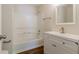 Clean bathroom featuring a tub/shower combination and a white vanity with modern fixtures at 3990 Howell Park Rd, Duluth, GA 30096