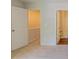 Neutral bedroom with an open white door and a bathroom entrance at 3990 Howell Park Rd, Duluth, GA 30096