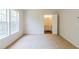 Bedroom with ensuite bathroom access and natural light at 3990 Howell Park Rd, Duluth, GA 30096