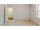 Bedroom with ensuite bathroom access and natural light from window at 3990 Howell Park Rd, Duluth, GA 30096