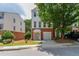 Charming townhome with brick accents, well-maintained landscaping, and a one-car garage at 3990 Howell Park Rd, Duluth, GA 30096