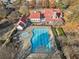 Aerial view of community pool with surrounding amenities and lush landscaping on a sunny day at 487 Carmichael Cir, Canton, GA 30115