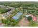 Aerial view of a residential neighborhood with community tennis courts, pool, and clubhouse at 487 Carmichael Cir, Canton, GA 30115