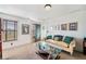 Bright bedroom featuring a couch, window with blinds, and neutral decor at 487 Carmichael Cir, Canton, GA 30115