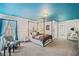 Elegant bedroom features a four poster bed, blue ceiling, and an ensuite bathroom at 487 Carmichael Cir, Canton, GA 30115