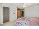 Cozy bedroom with a floral patterned bed and a spacious walk-in closet at 487 Carmichael Cir, Canton, GA 30115
