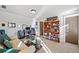 Versatile bonus room with cozy sofa and office space at 487 Carmichael Cir, Canton, GA 30115