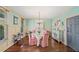 Elegant dining room featuring hardwood floors, a vintage chandelier, and a decorative china cabinet at 487 Carmichael Cir, Canton, GA 30115
