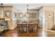 Charming dining room with hardwood floors, decorative lighting, and wainscoting offers an inviting atmosphere at 487 Carmichael Cir, Canton, GA 30115