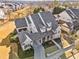 Stunning two-story home featuring a landscaped yard and a covered front porch with white columns in a lovely suburban neighborhood at 487 Carmichael Cir, Canton, GA 30115