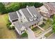 Beautiful two-story home with manicured lawn, covered porch and columns, plus an attached garage and a lush green lawn at 487 Carmichael Cir, Canton, GA 30115