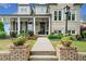 Well-maintained brick home with lush landscaping and attractive front porch at 487 Carmichael Cir, Canton, GA 30115