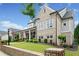 Lovely exterior displaying a covered porch with columns, tasteful landscaping, and brick details at 487 Carmichael Cir, Canton, GA 30115