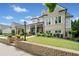 Attractive exterior showcasing a covered porch with columns, well-maintained landscaping, and brick accents at 487 Carmichael Cir, Canton, GA 30115
