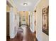 Inviting hallway with hardwood floors, neutral walls, and elegant decor at 487 Carmichael Cir, Canton, GA 30115